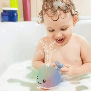 Light up whale bathtub toy for kids with water-activated