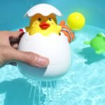 cute baby bathing water toy with duck and penguin that spray water for fun bath play